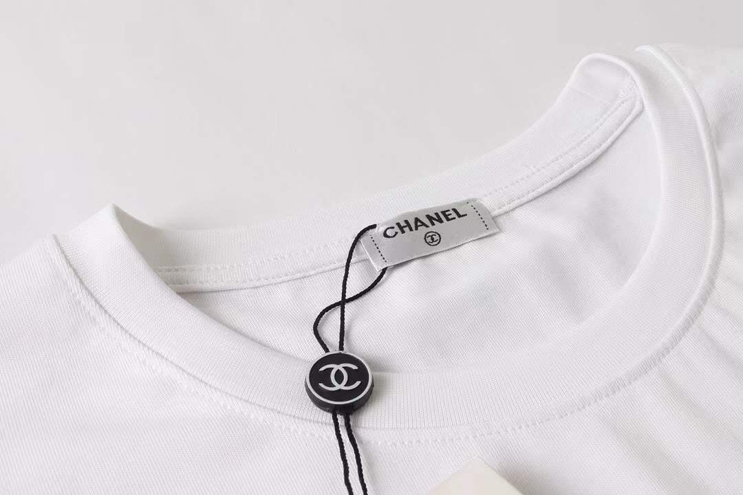 Chanel themed t-shirt featuring a bear graphic, similar to designs found on various retail platforms