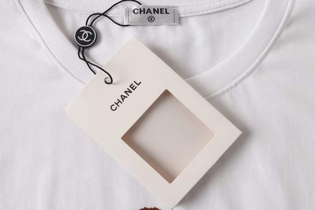 Chanel themed t-shirt featuring a bear graphic, similar to designs found on various retail platforms