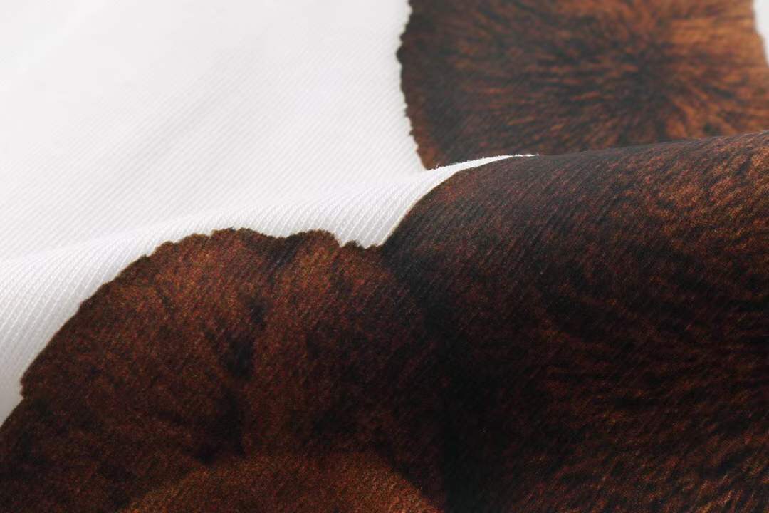 Chanel themed t-shirt featuring a bear graphic, similar to designs found on various retail platforms