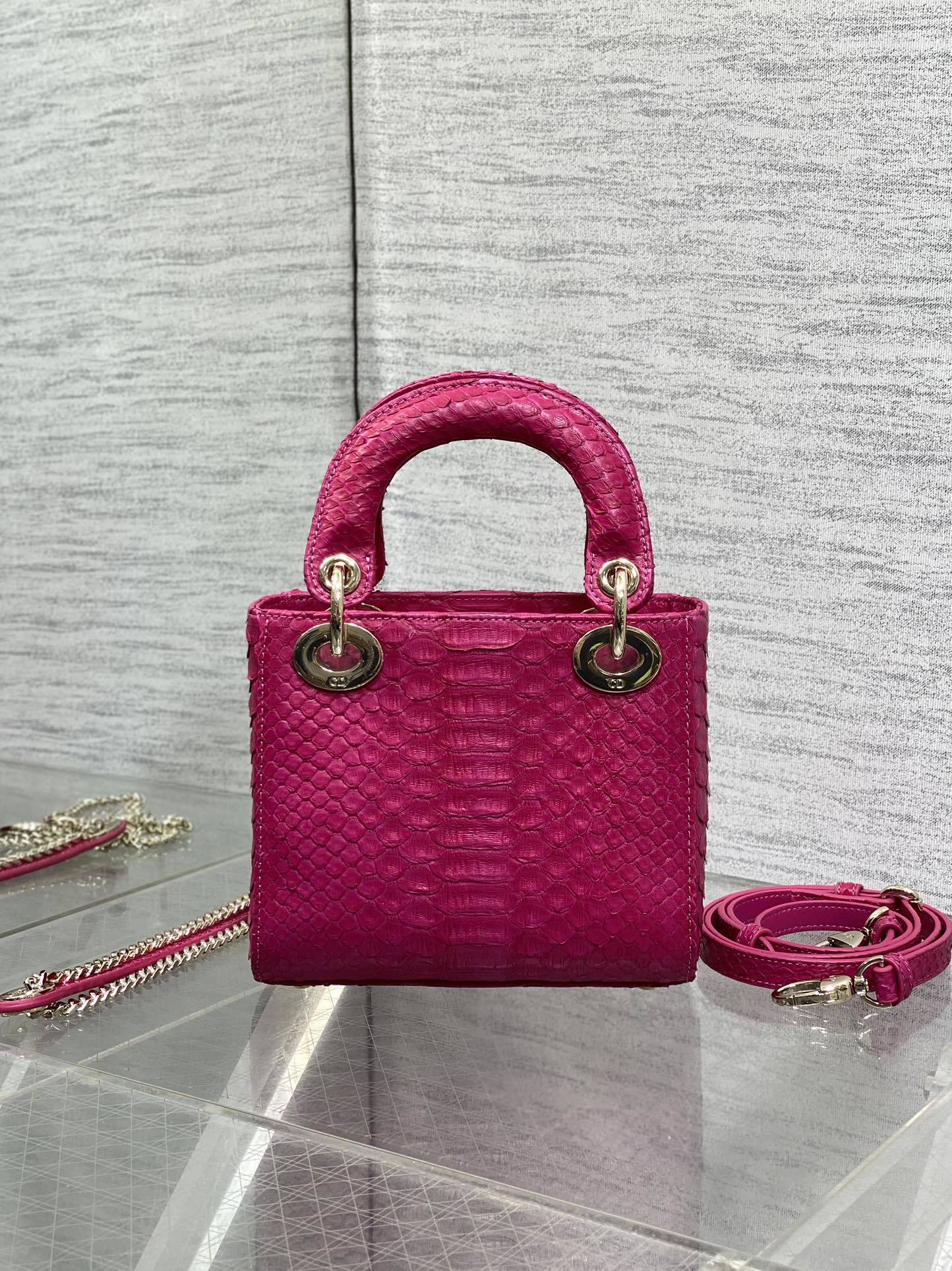 Christian Dior Mini Lady Dior handbag made of fuchsia pink python leather