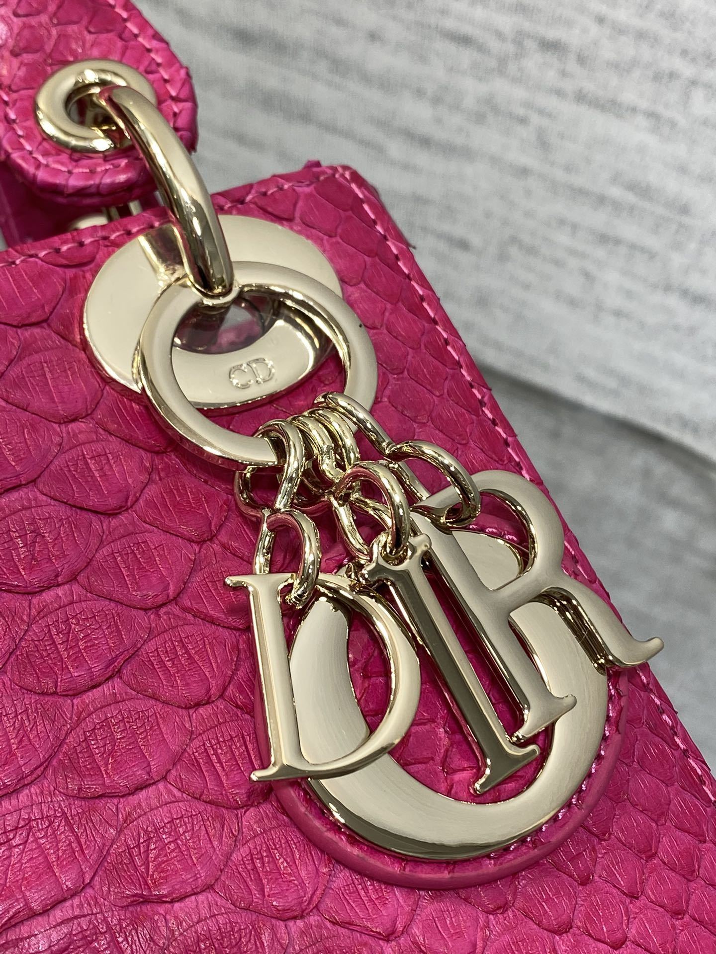 Christian Dior Mini Lady Dior handbag made of fuchsia pink python leather
