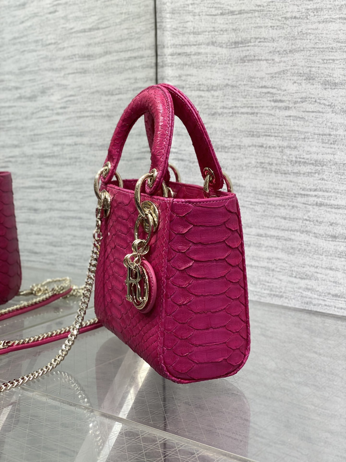 Christian Dior Mini Lady Dior handbag made of fuchsia pink python leather