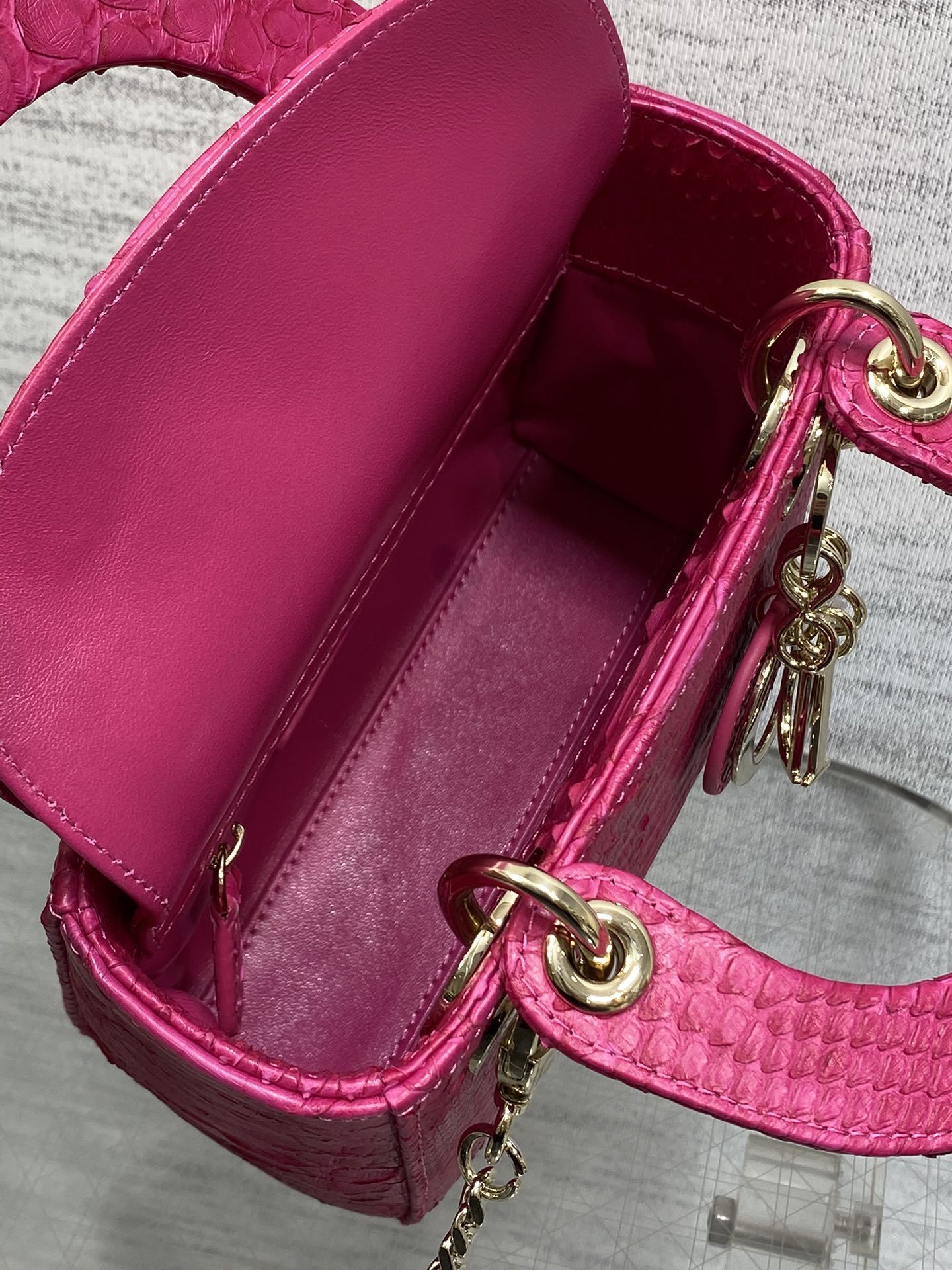 Christian Dior Mini Lady Dior handbag made of fuchsia pink python leather
