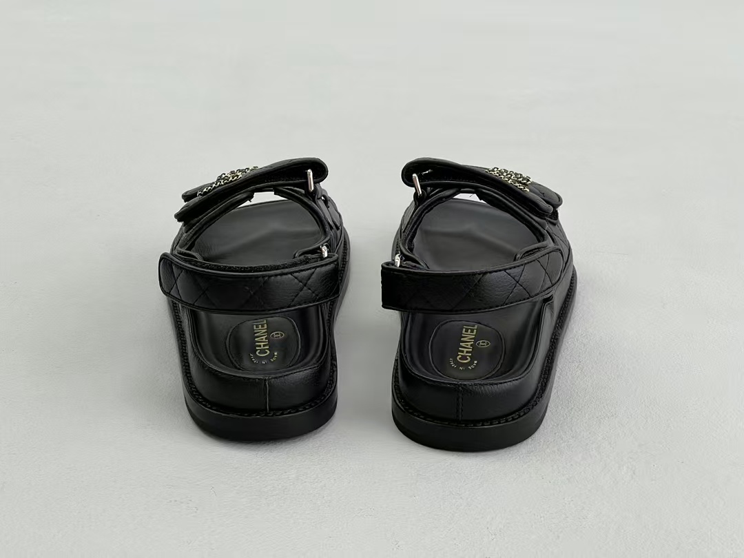 Chanel sandals feature a diamond-quilted finish and the signature interlocking CC logo on the touch-strap fastenings