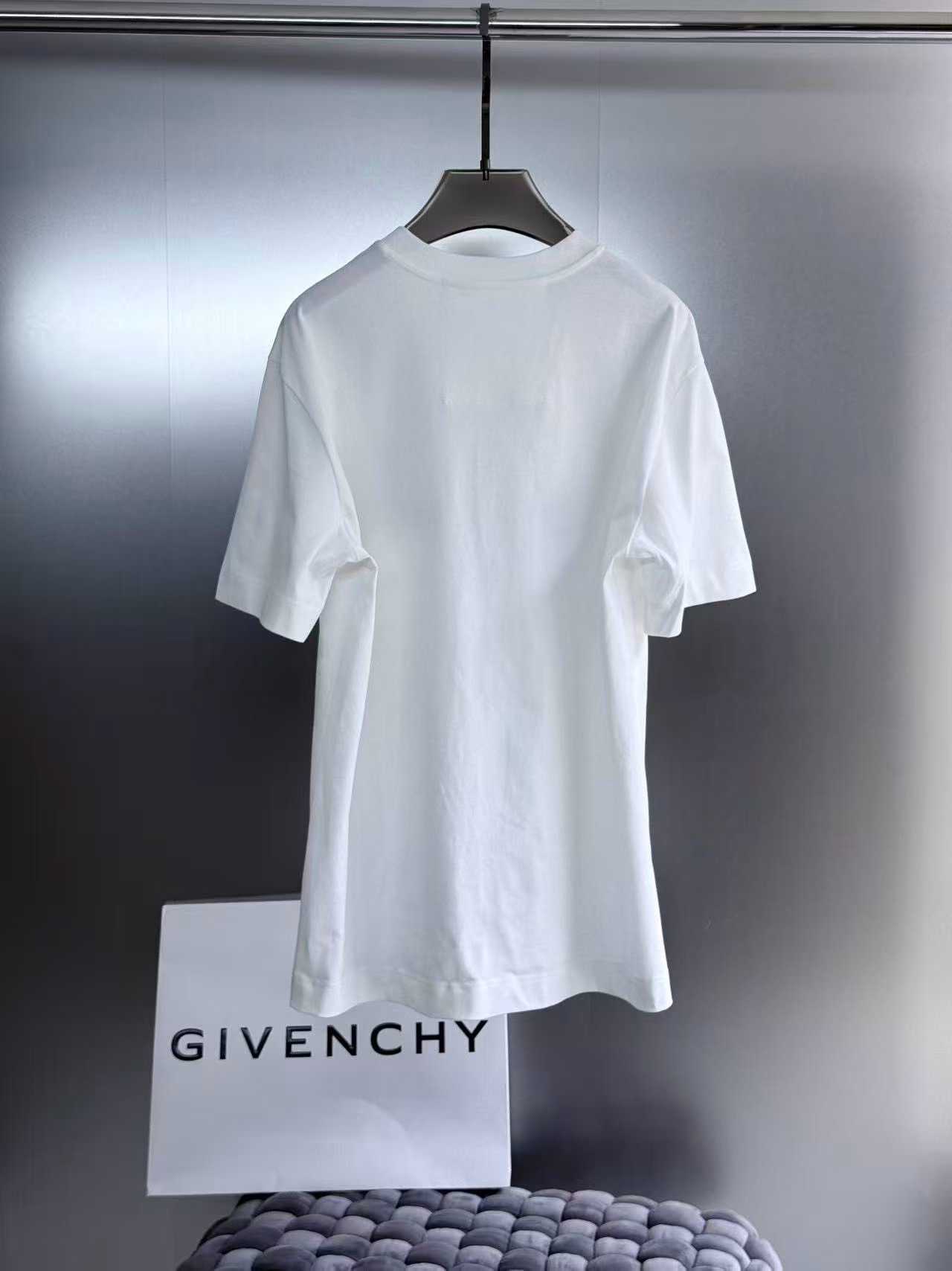 Givenchy white College Tee featuring an embroidered black and white stylized letter "G" logo patch on the chest.