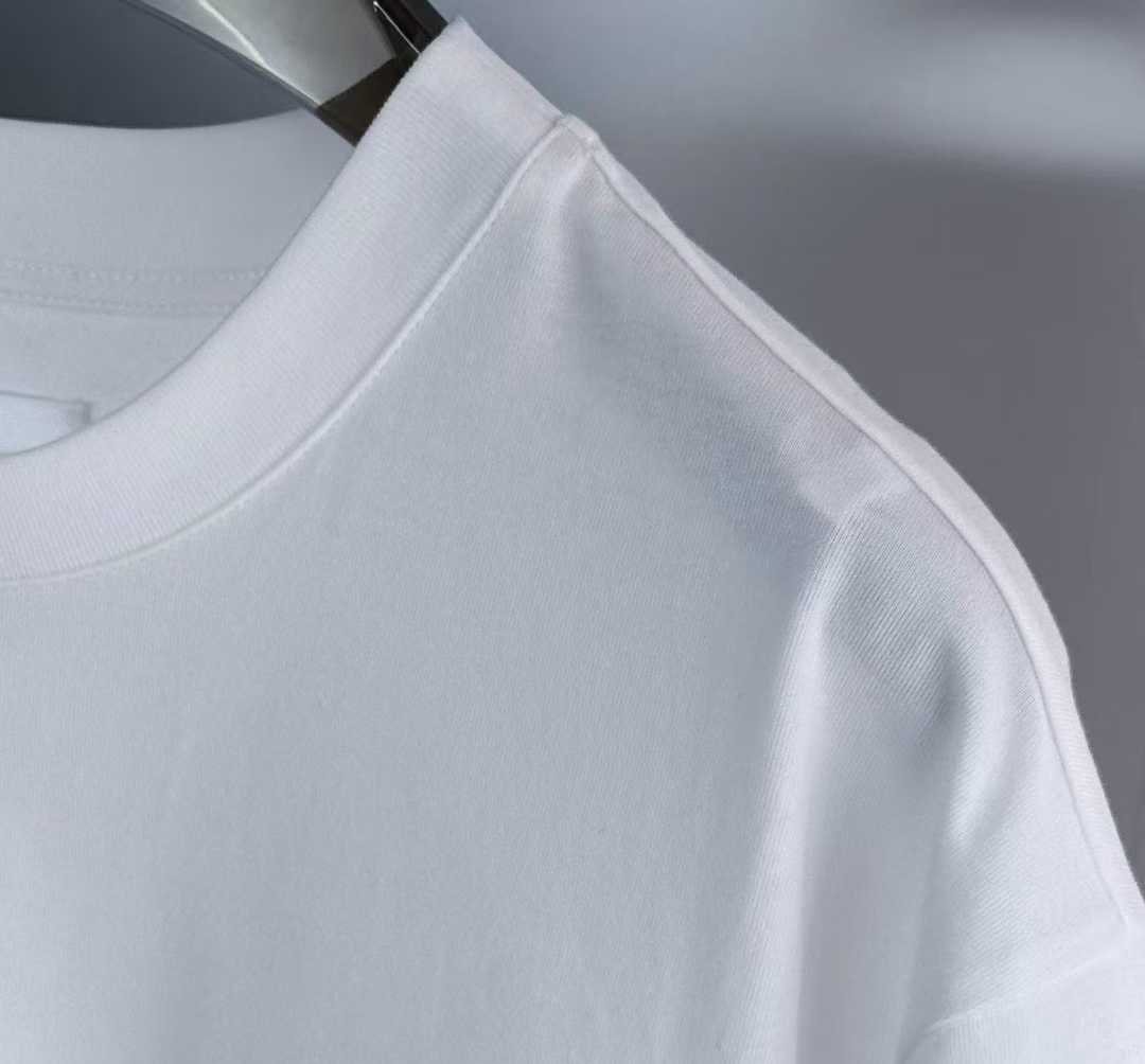 Givenchy white College Tee featuring an embroidered black and white stylized letter "G" logo patch on the chest.