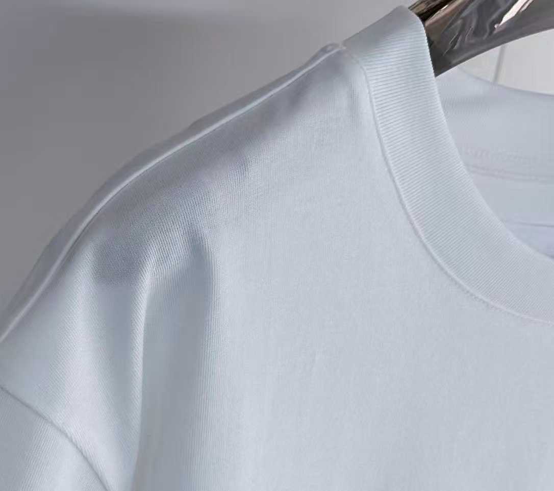 Givenchy white College Tee featuring an embroidered black and white stylized letter "G" logo patch on the chest.