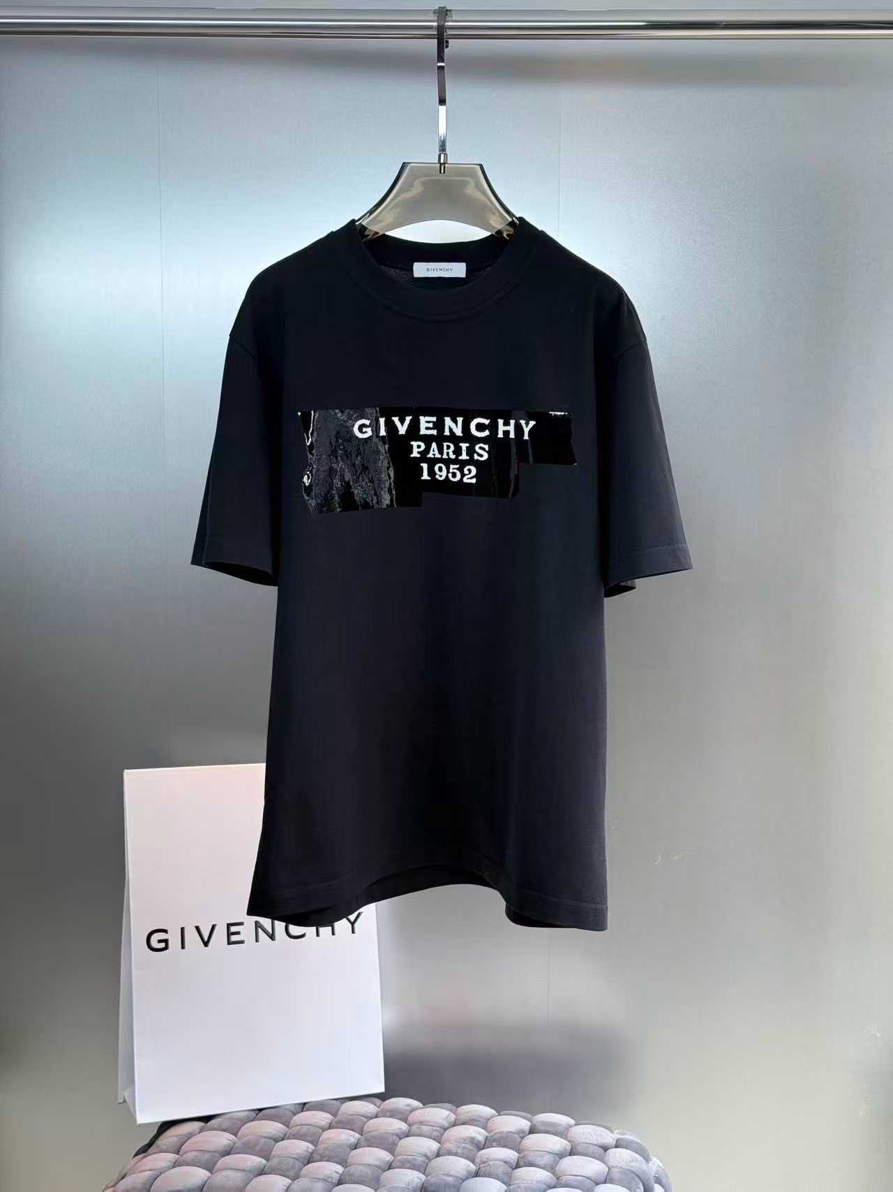 Givenchy cotton T-shirt featuring a distinctive "Givenchy Paris 1952" tape logo print on the front
