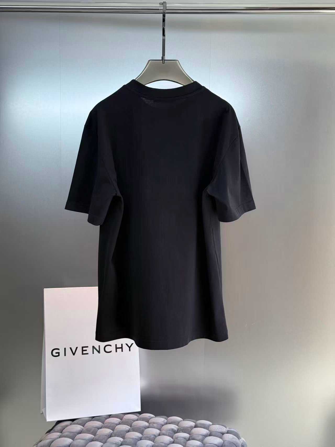 Givenchy cotton T-shirt featuring a distinctive "Givenchy Paris 1952" tape logo print on the front