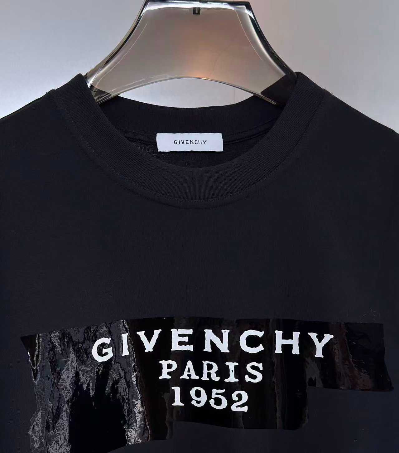 Givenchy cotton T-shirt featuring a distinctive "Givenchy Paris 1952" tape logo print on the front