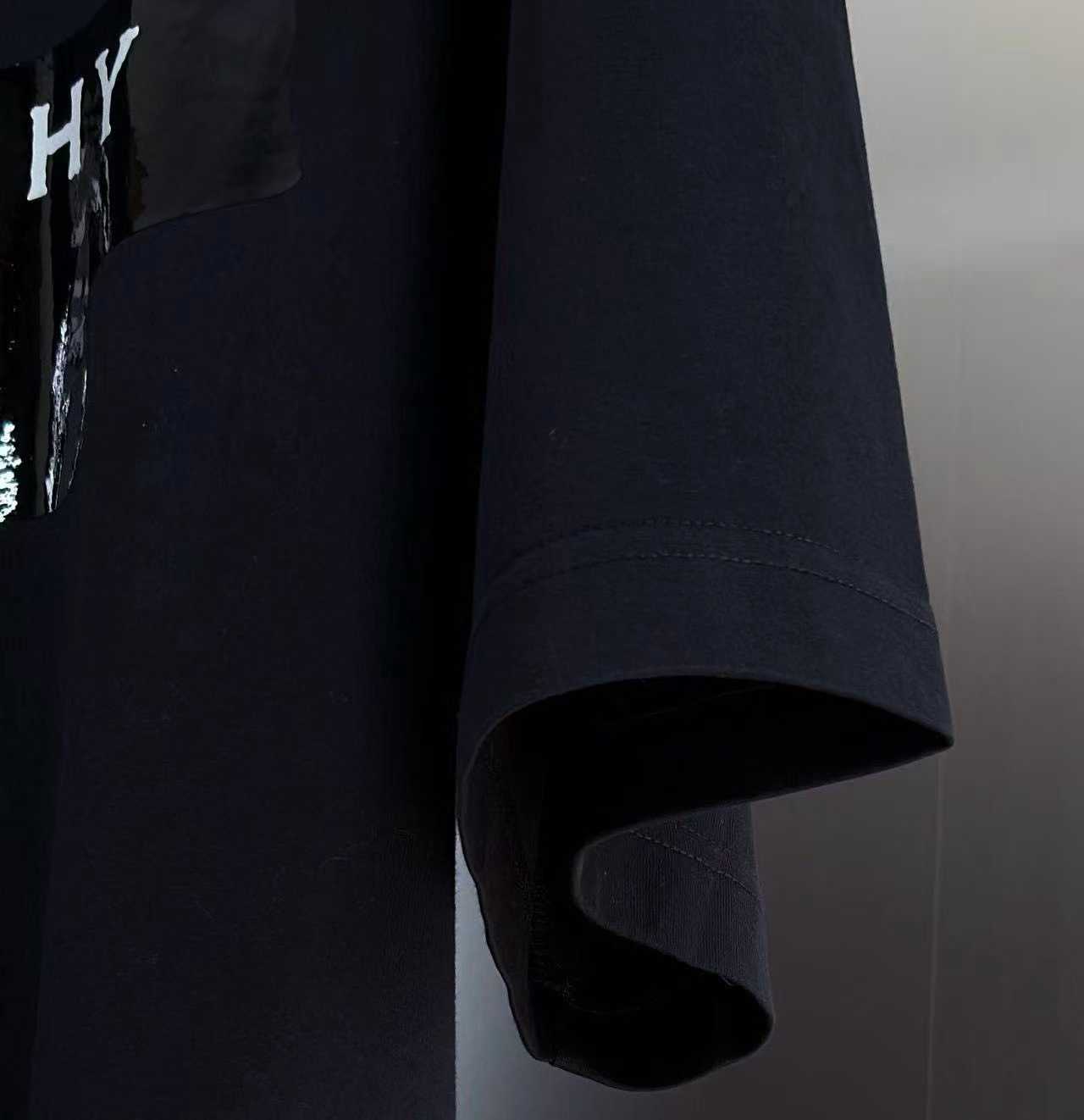 Givenchy cotton T-shirt featuring a distinctive "Givenchy Paris 1952" tape logo print on the front