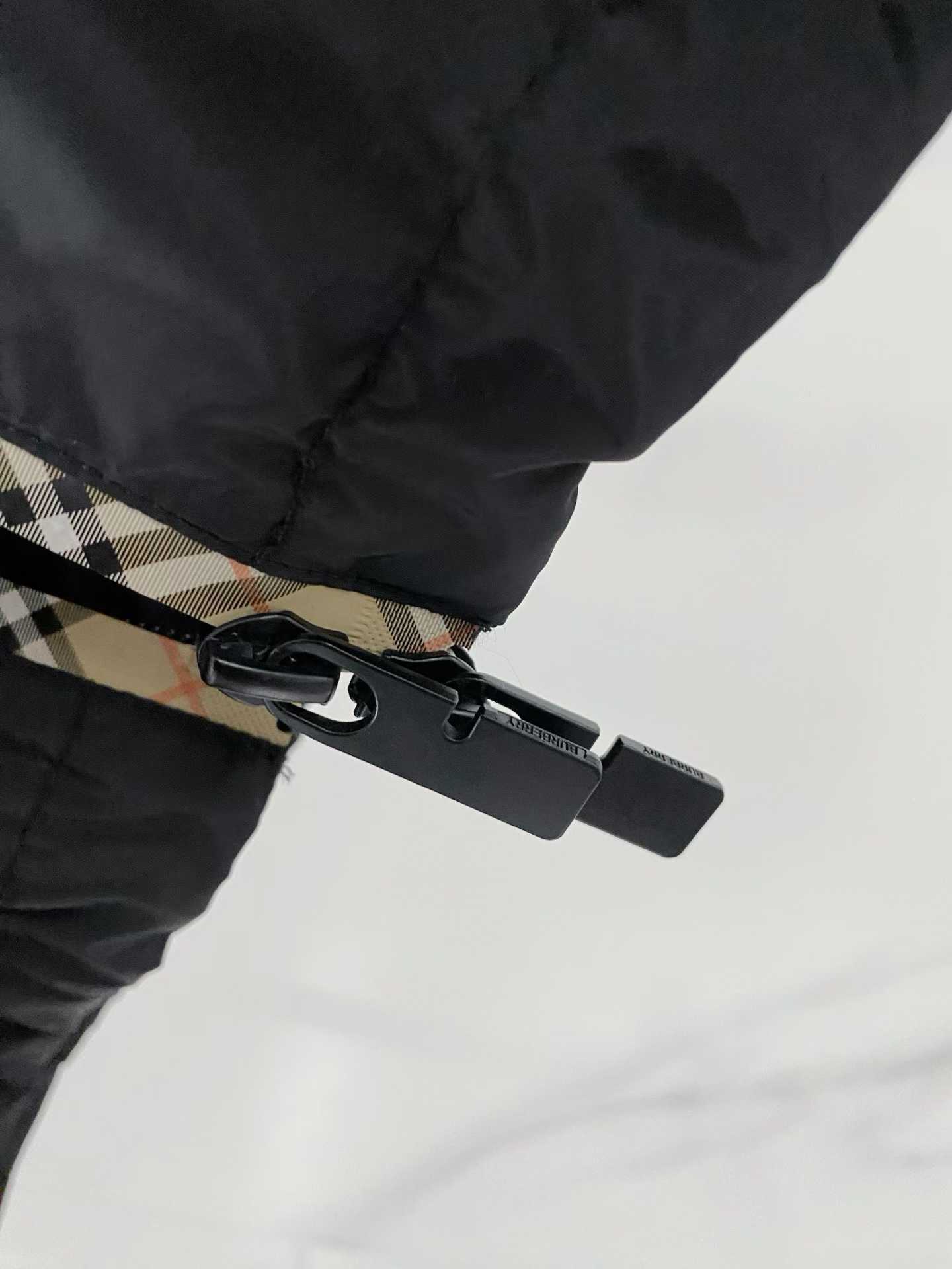 Burberry black check motif hooded jacket, which is a lightweight, reversible nylon jacket featuring the brand's iconic house check pattern