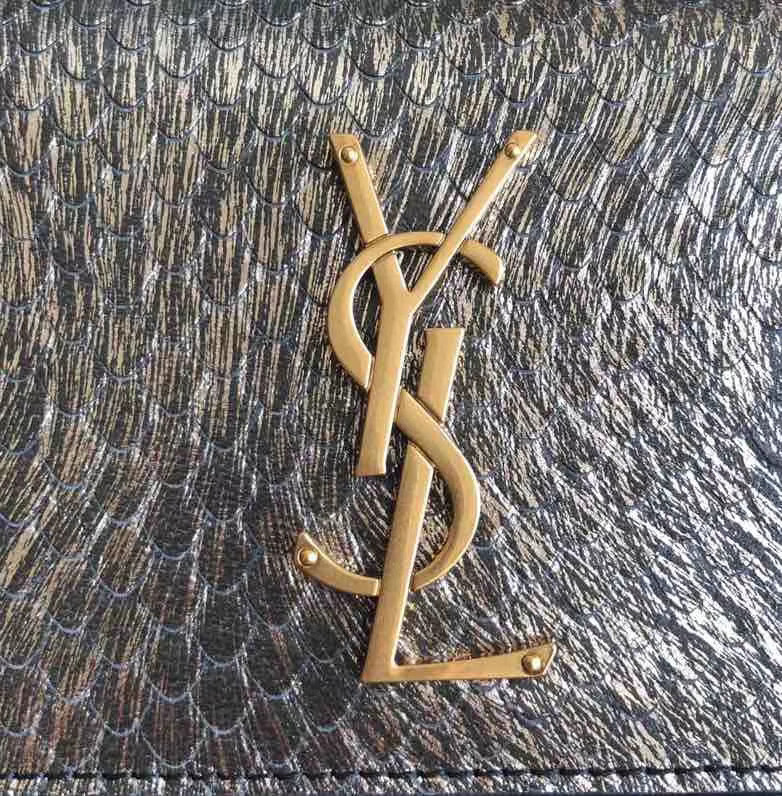 Saint Laurent Sunset Medium chain bag known for its structured accordion silhouette and iconic YSL monogram hardware