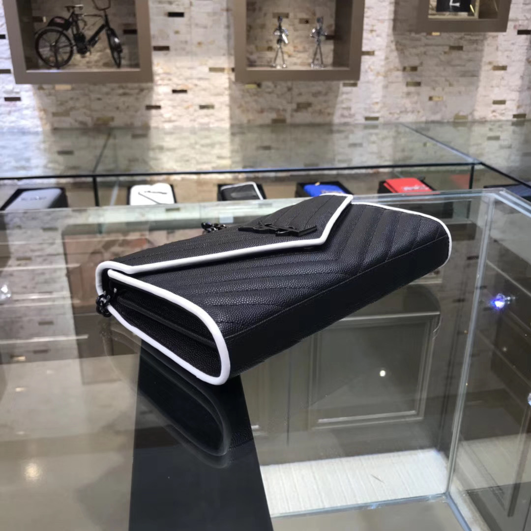 Saint Laurent Cassandre Matelassé Chain Wallet in black quilted leather with white trim