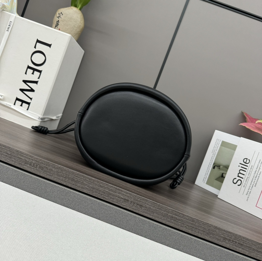 Loewe Flamenco Purse Bucket bag crafted from black nappa lambskin leather and featuring a signature gold chain strap