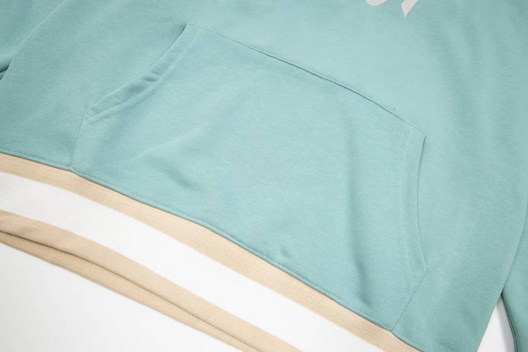 Dior aqua blue cotton fleece hooded sweatshirt featuring a revisited Christian Dior Paris signature on the front.