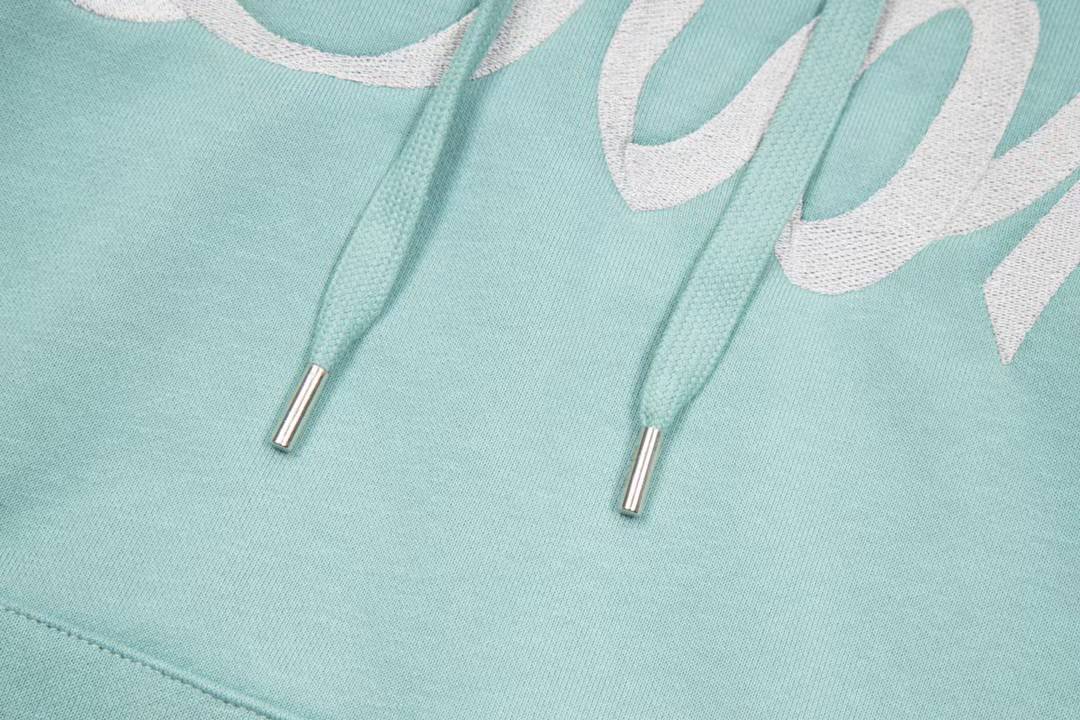 Dior aqua blue cotton fleece hooded sweatshirt featuring a revisited Christian Dior Paris signature on the front.