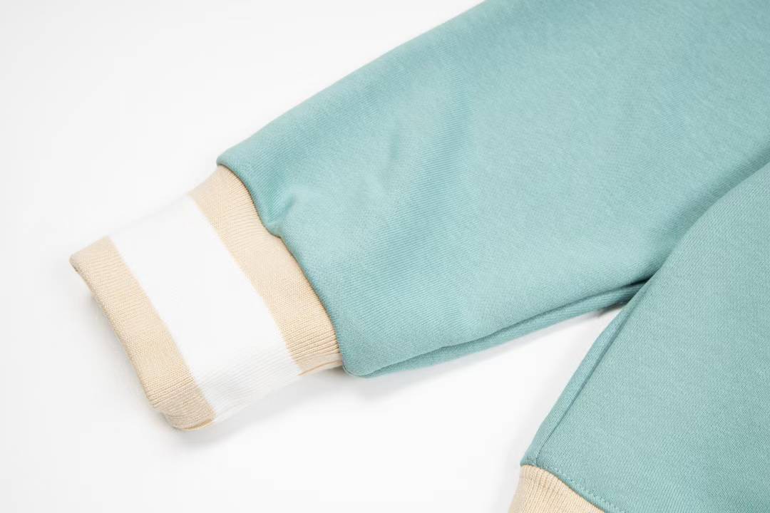 Dior aqua blue cotton fleece hooded sweatshirt featuring a revisited Christian Dior Paris signature on the front.