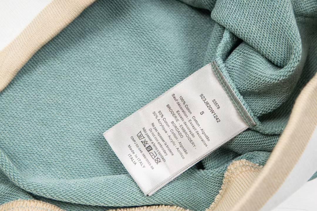 Dior aqua blue cotton fleece hooded sweatshirt featuring a revisited Christian Dior Paris signature on the front.