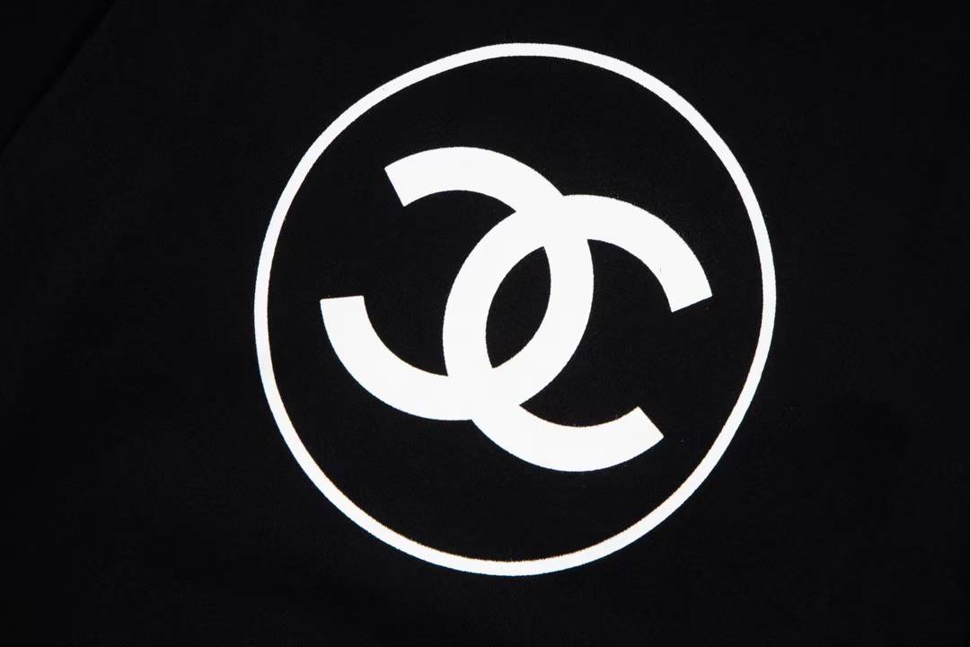 Chanel sweatshirt featuring a prominent white circular logo