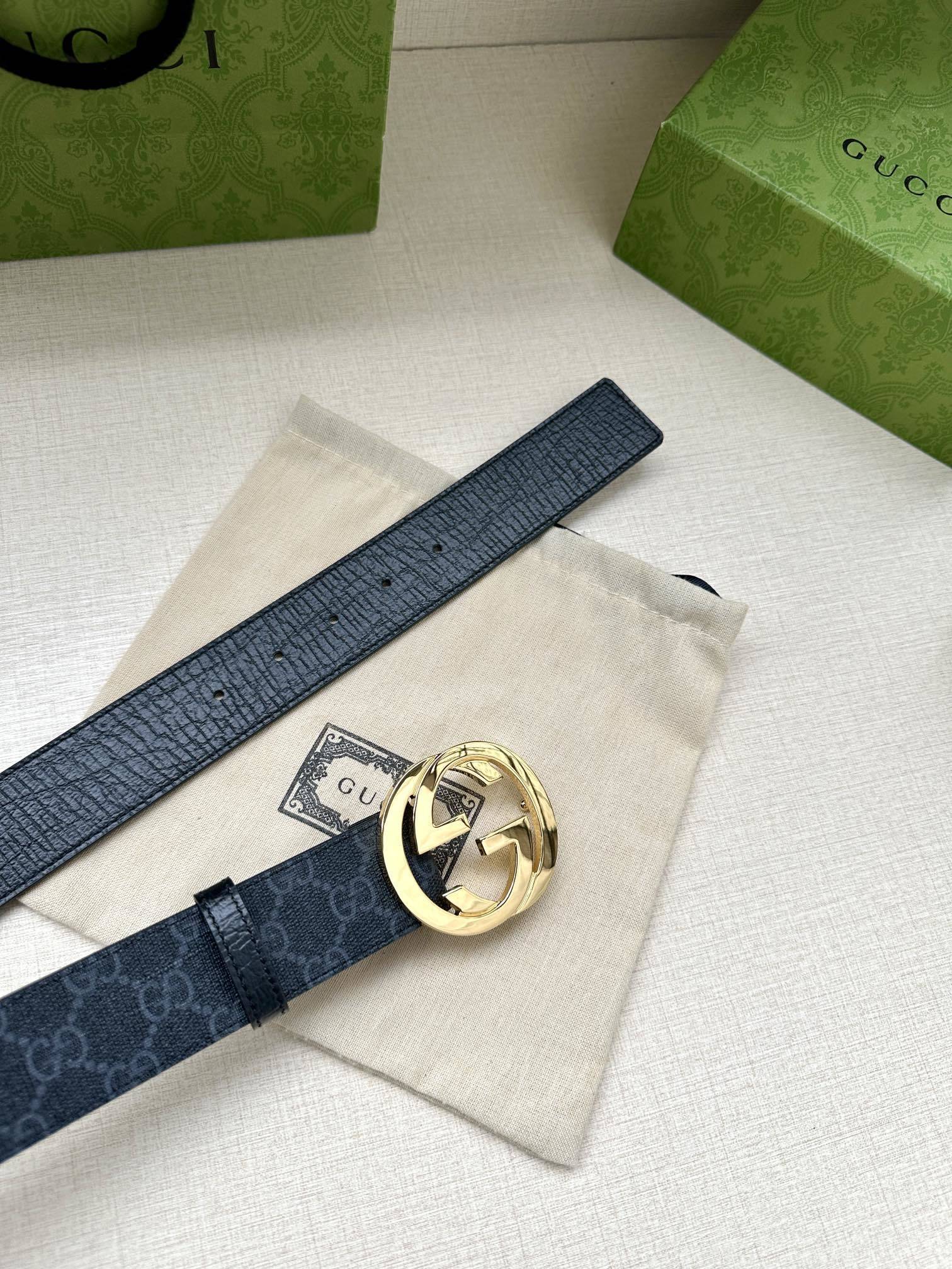 Gucci belt is a Black/Grey GG Supreme canvas belt featuring a signature silver-tone Interlocking G buckle