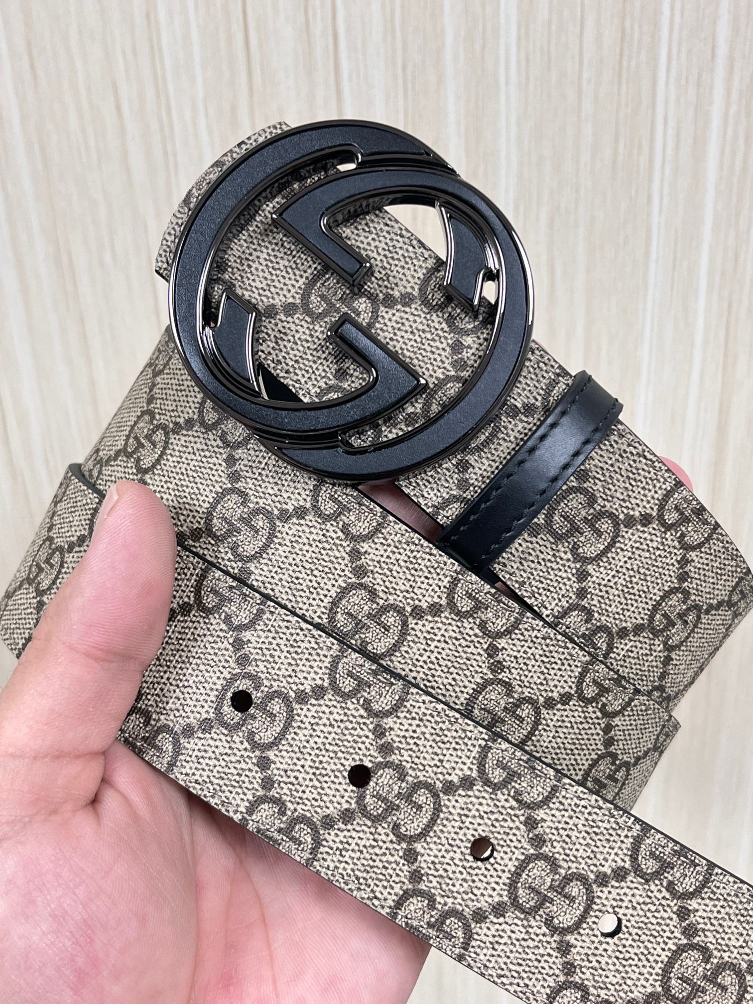 Gucci Marmont belt featuring a GG Supreme print canvas strap and a metallic Interlocking G buckle