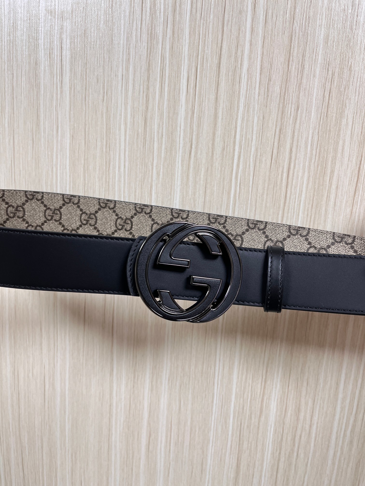 Gucci Marmont belt featuring a GG Supreme print canvas strap and a metallic Interlocking G buckle