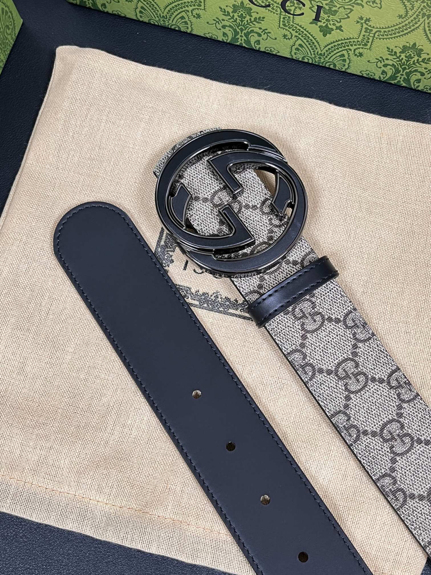 Gucci Marmont belt featuring a GG Supreme print canvas strap and a metallic Interlocking G buckle