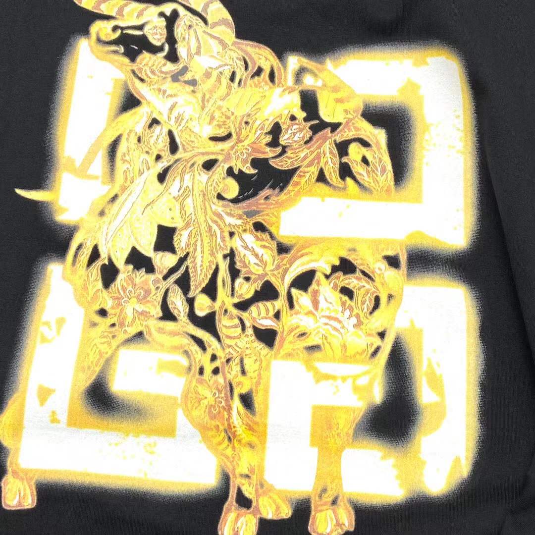 Givenchy black cotton T-shirt featuring a distinctive distressed gold logo print on the chest