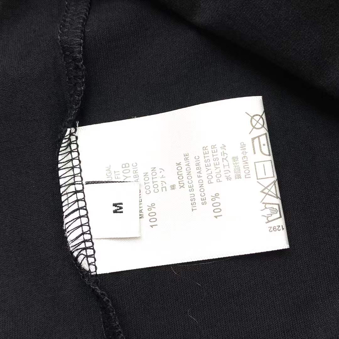 Givenchy black cotton T-shirt featuring a distinctive distressed gold logo print on the chest