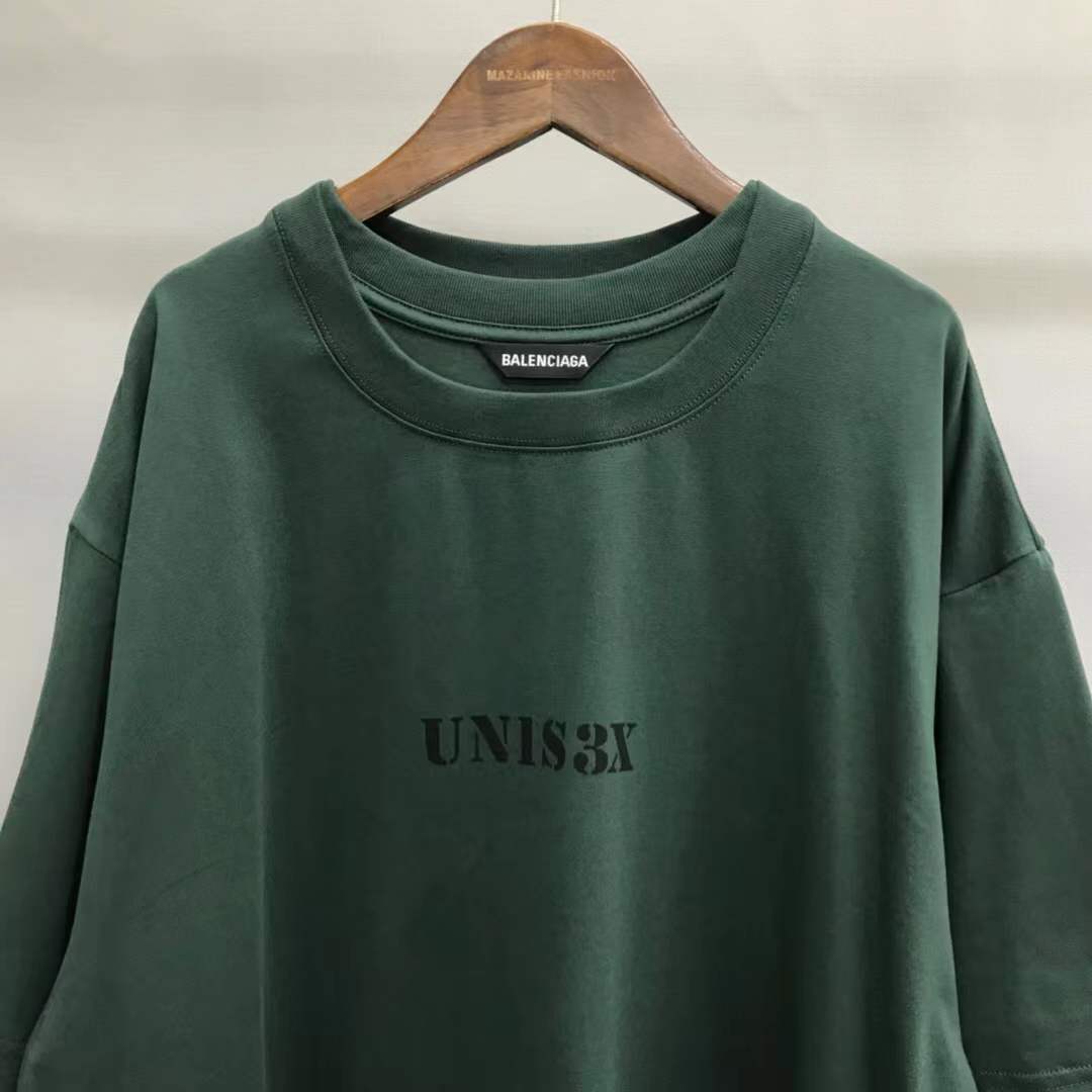 Balenciaga Unisex-Print Large Fit T-shirt in Green features "UNIS3X" text on the front.