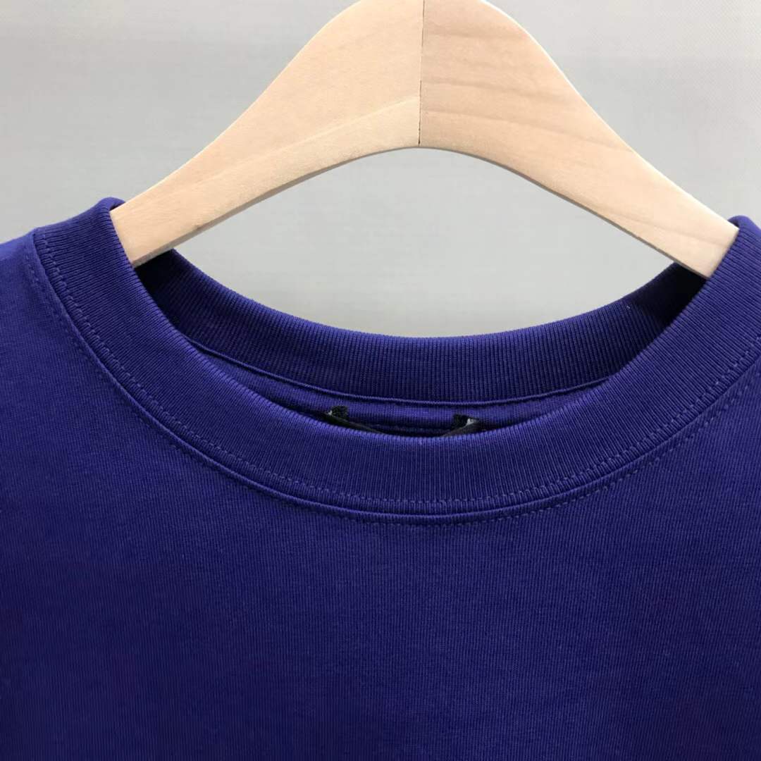 Balenciaga Dry Cleaning Boxy T-Shirt in blue cotton features a short-sleeved, crewneck design with a printed motif on the front