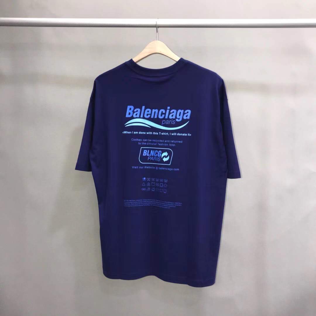 Balenciaga Dry Cleaning Boxy T-Shirt in blue cotton features a short-sleeved, crewneck design with a printed motif on the front