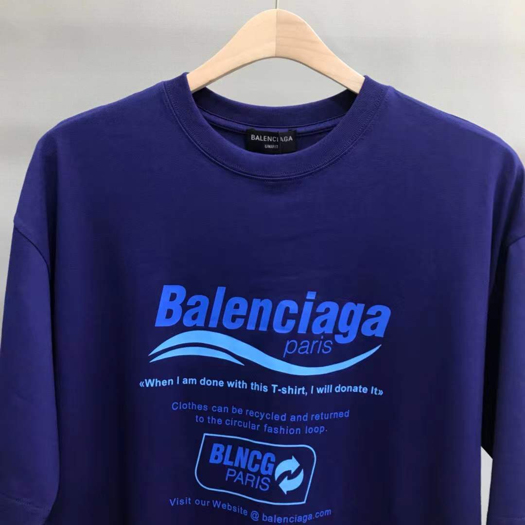 Balenciaga Dry Cleaning Boxy T-Shirt in blue cotton features a short-sleeved, crewneck design with a printed motif on the front