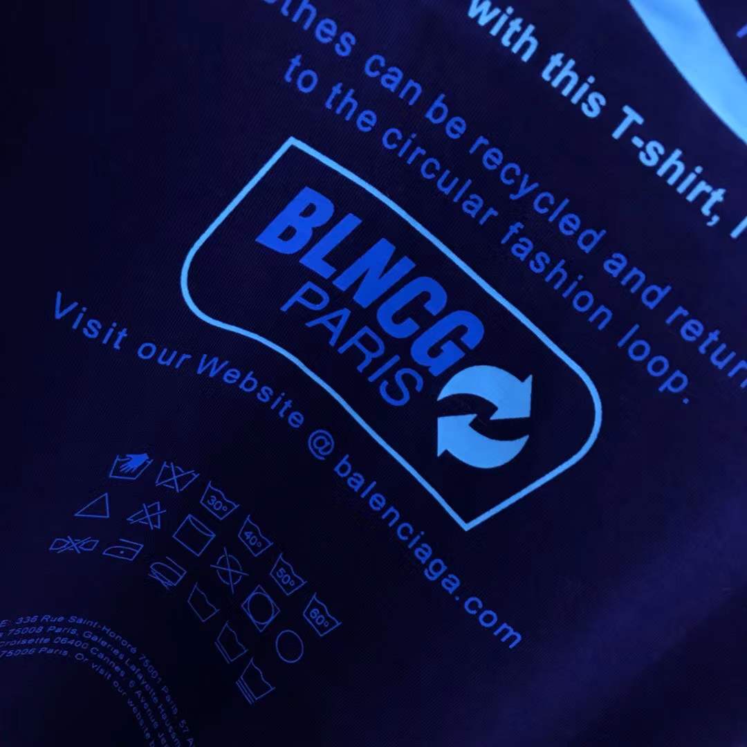 Balenciaga Dry Cleaning Boxy T-Shirt in blue cotton features a short-sleeved, crewneck design with a printed motif on the front