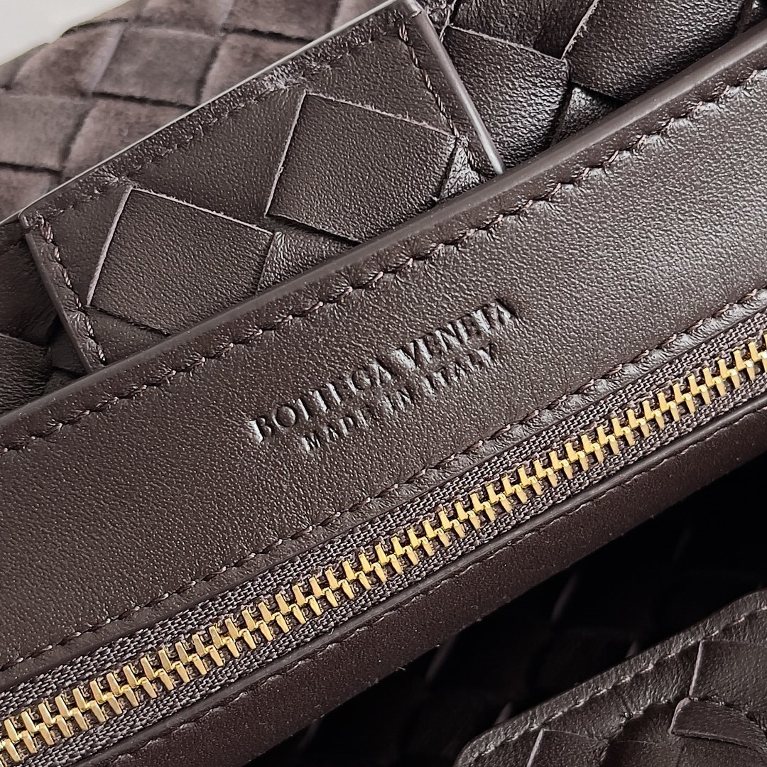 Bottega Veneta Small Andiamo Top Handle Bag featuring the brand's signature Intrecciato woven design in suede.