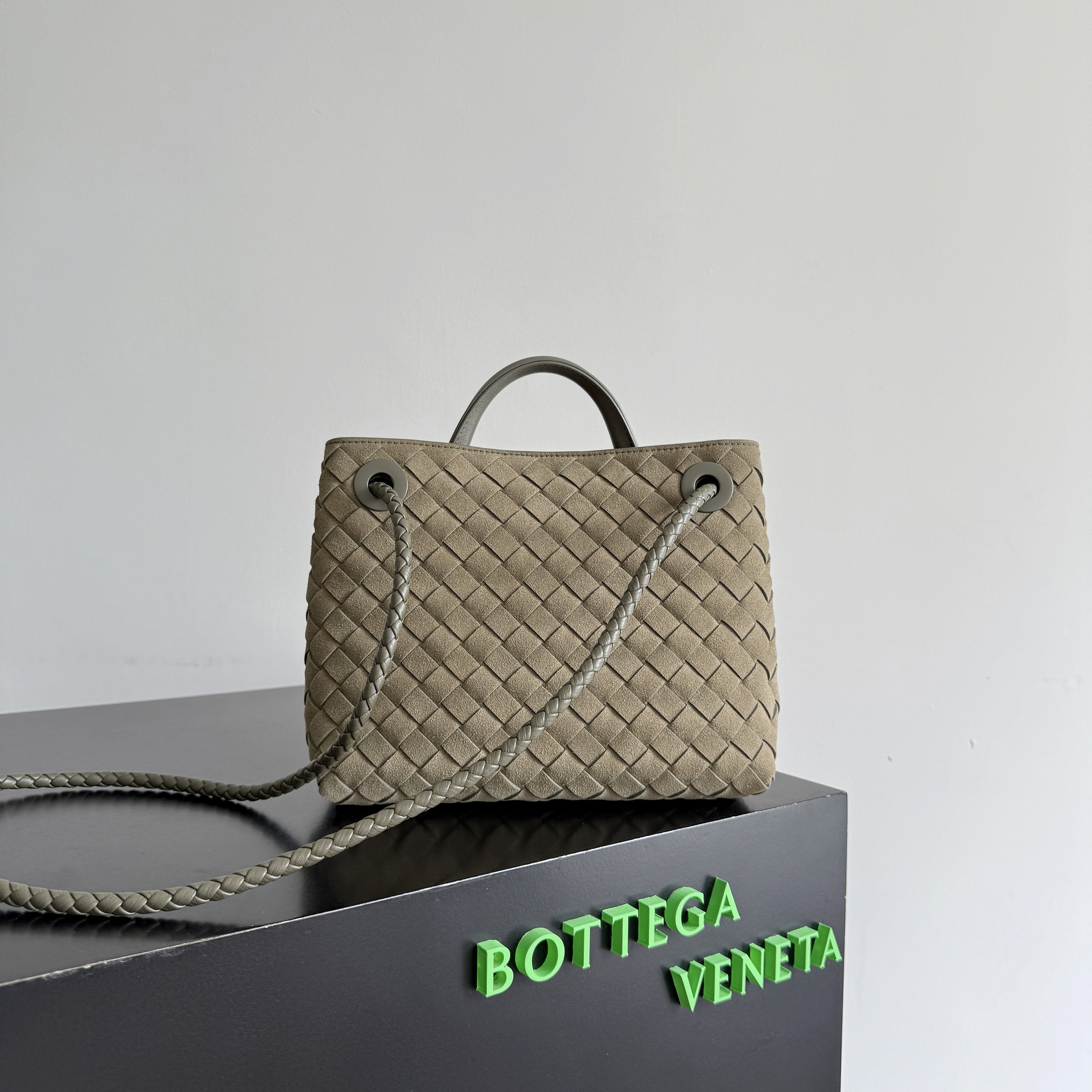 Bottega Veneta Small Andiamo top handle bag featuring the brand's signature intrecciato woven leather craftsmanship