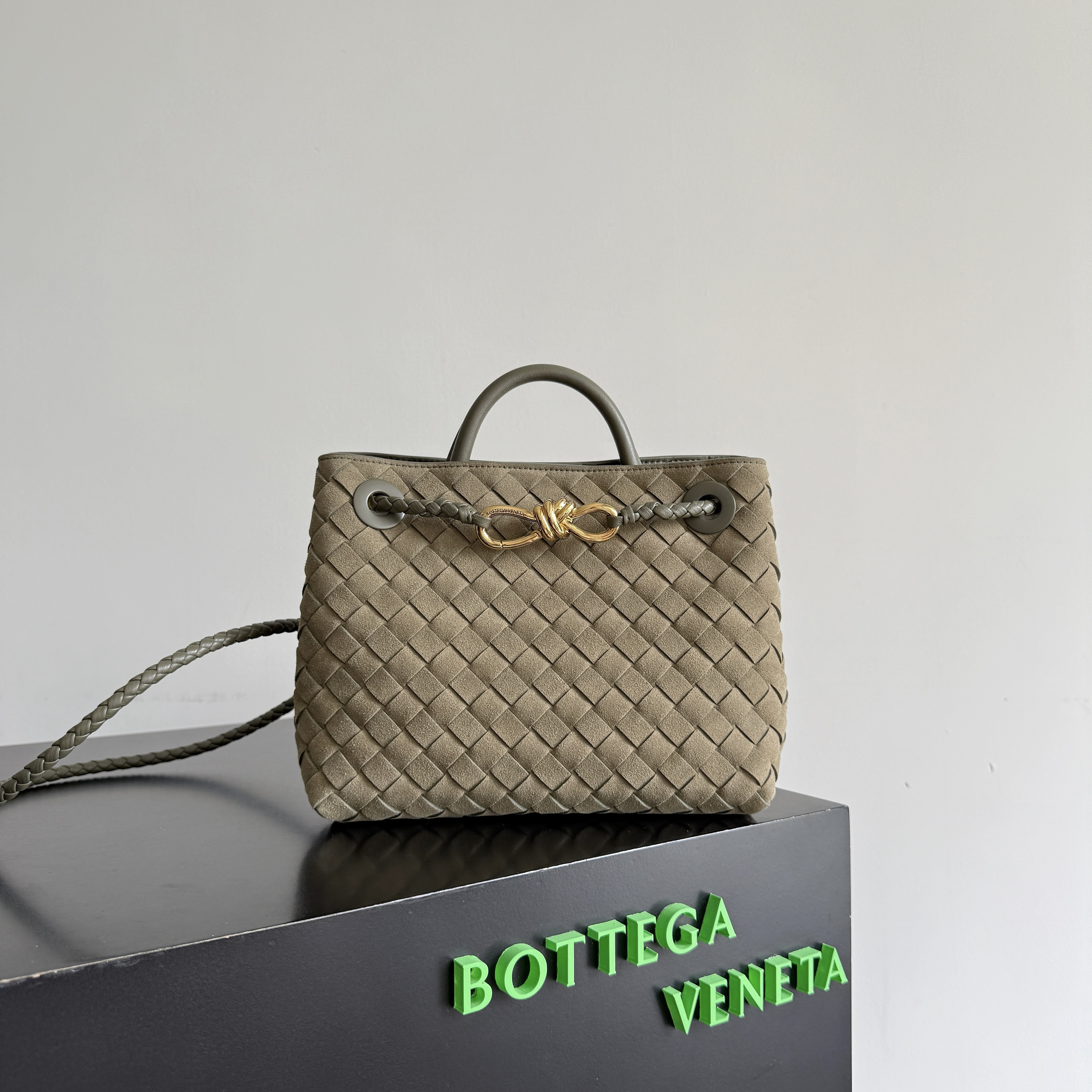Bottega Veneta Small Andiamo top handle bag featuring the brand's signature intrecciato woven leather craftsmanship