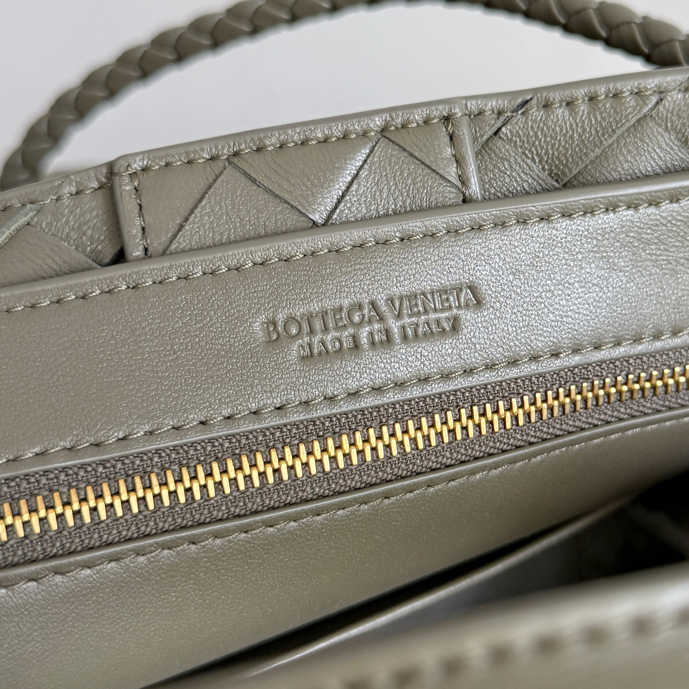 Bottega Veneta Small Andiamo top handle bag featuring the brand's signature intrecciato woven leather craftsmanship