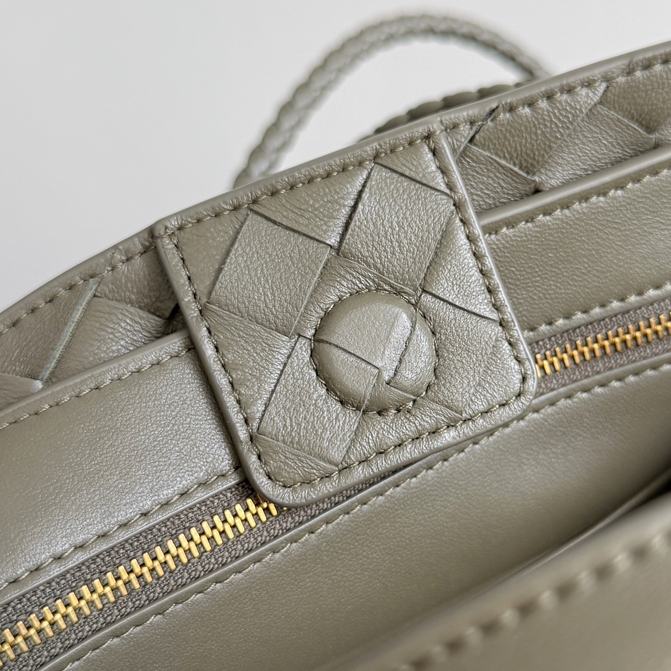 Bottega Veneta Small Andiamo top handle bag featuring the brand's signature intrecciato woven leather craftsmanship