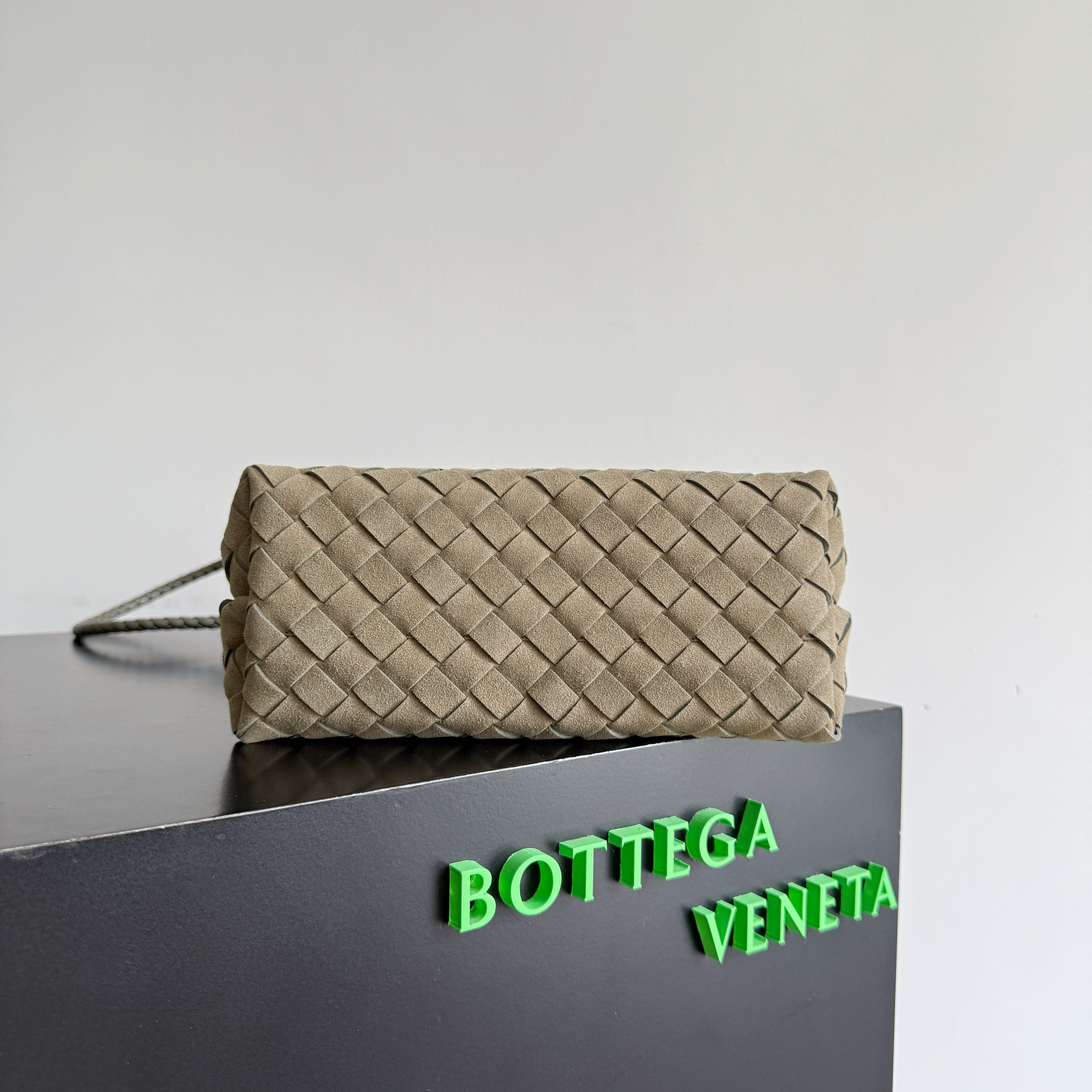 Bottega Veneta Small Andiamo top handle bag featuring the brand's signature intrecciato woven leather craftsmanship