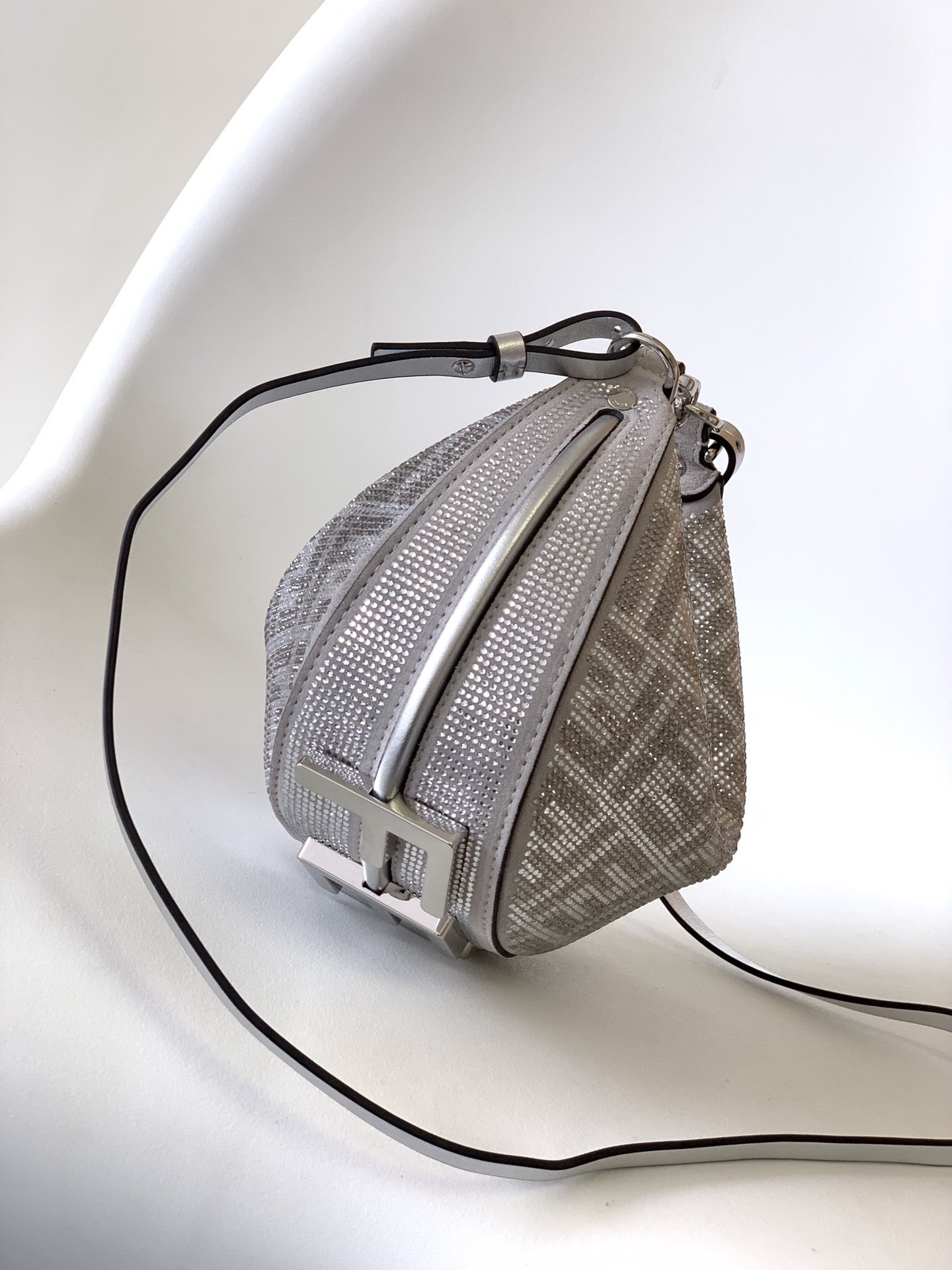 Fendi Fendigraphy Mini hobo bag featuring the brand's signature FF jacquard motif fabric and metal lettering on the bottom