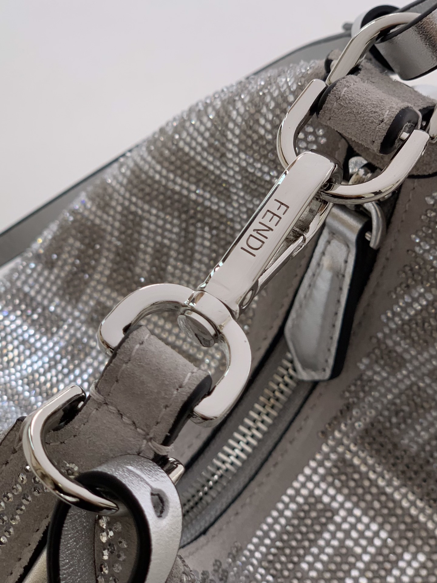 Fendi Fendigraphy Mini hobo bag featuring the brand's signature FF jacquard motif fabric and metal lettering on the bottom