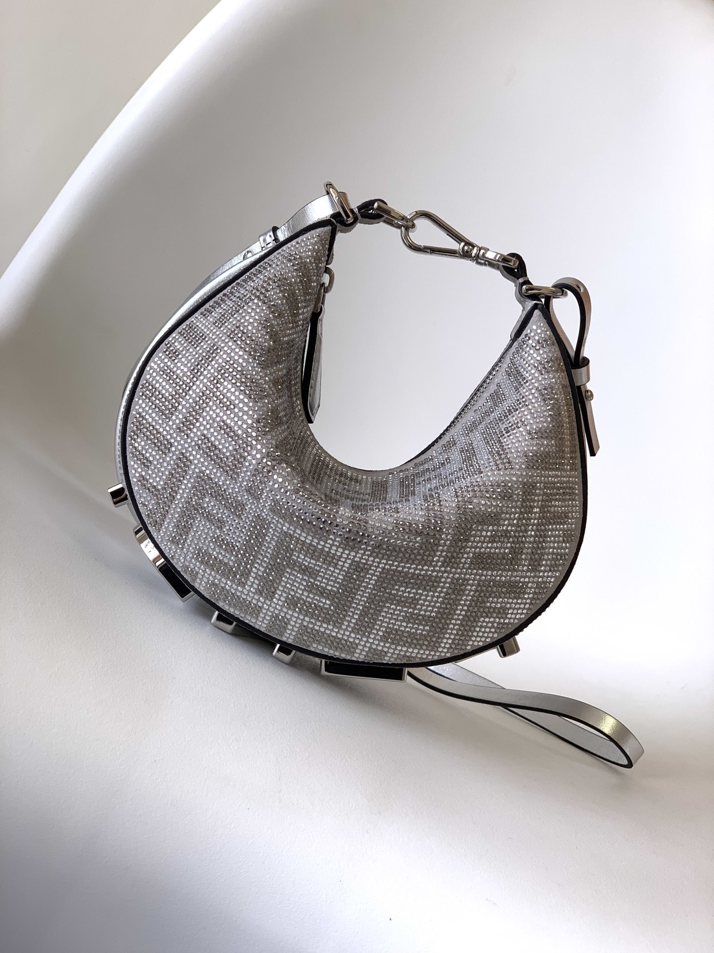 Fendi Fendigraphy Mini hobo bag featuring the brand's signature FF jacquard motif fabric and metal lettering on the bottom