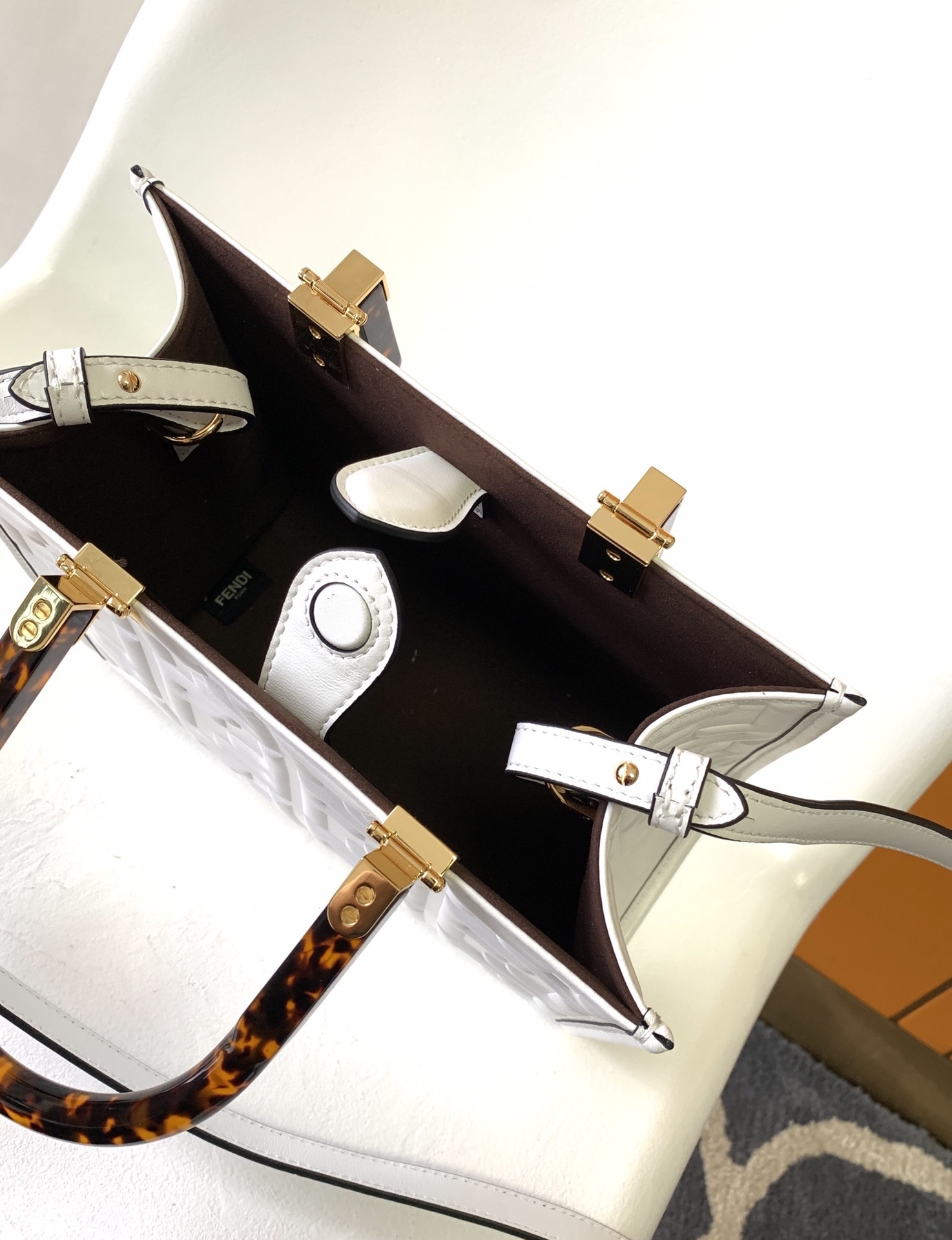 Fendi Sunshine Small Leather Shopper bag featuring the iconic FF logo embossed in 3D and distinctive tortoiseshell plexiglass handles