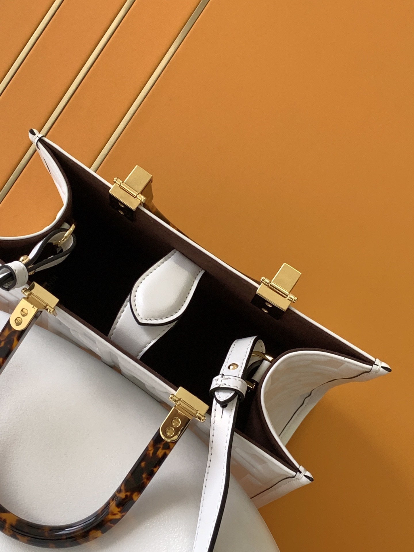 Fendi Sunshine Small Leather Shopper bag featuring the iconic FF logo embossed in 3D and distinctive tortoiseshell plexiglass handles