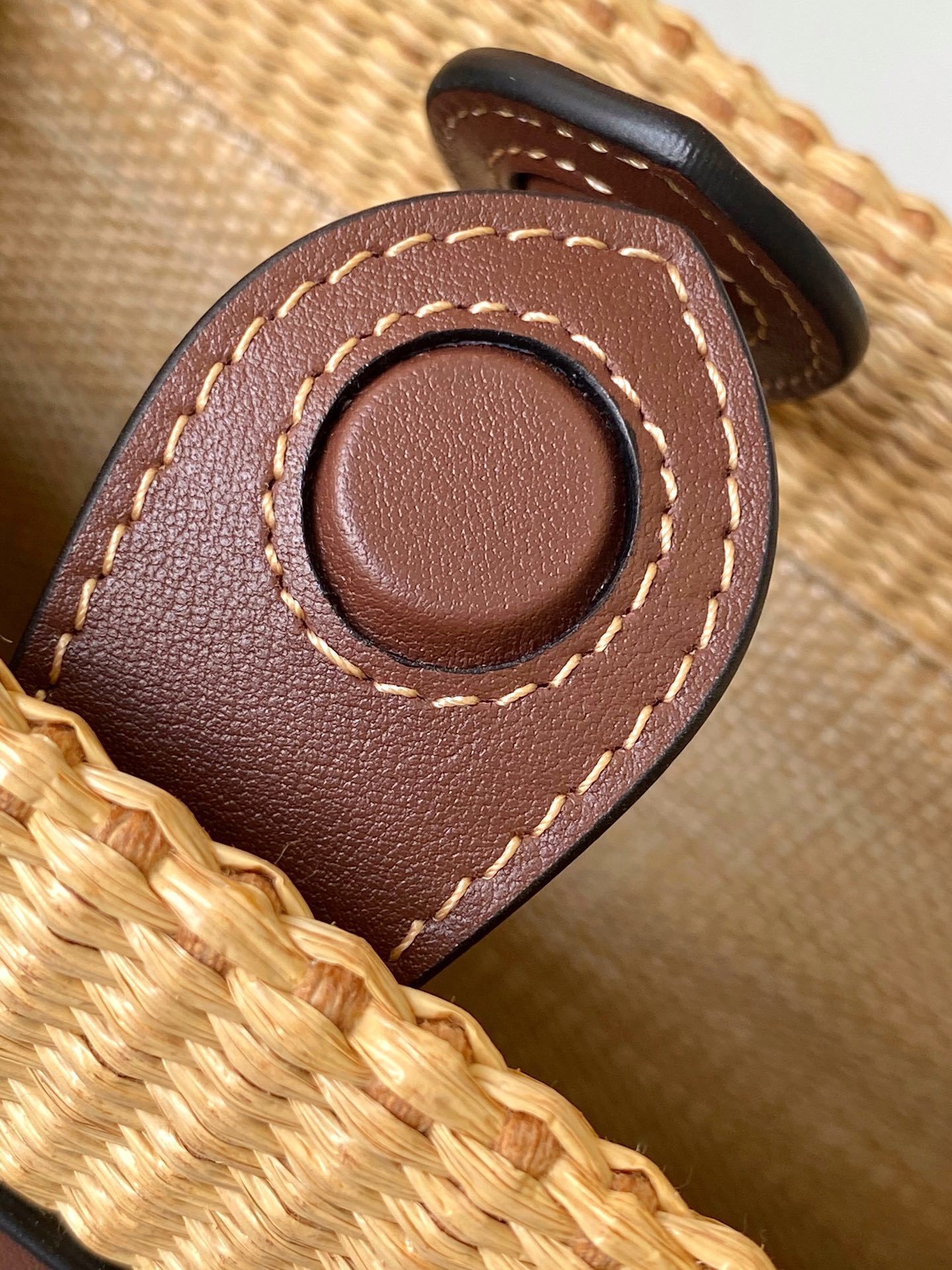 Fendi Sunshine tote bag is crafted from beige natural fiber raffia with brown leather trim and prominent "Fendi Roma" lettering