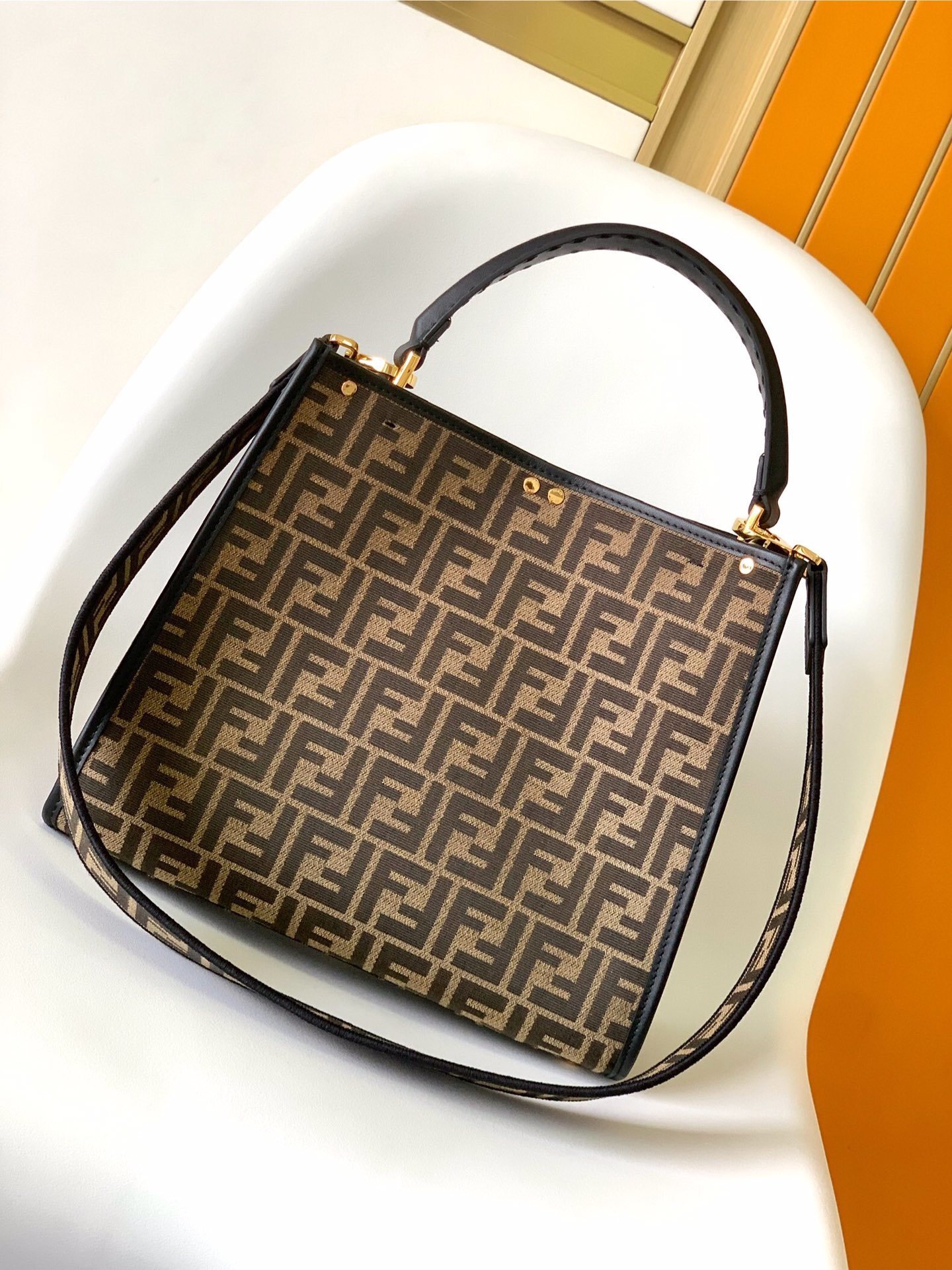 Fendi Peekaboo top handle bag featuring the iconic Zucca monogram pattern