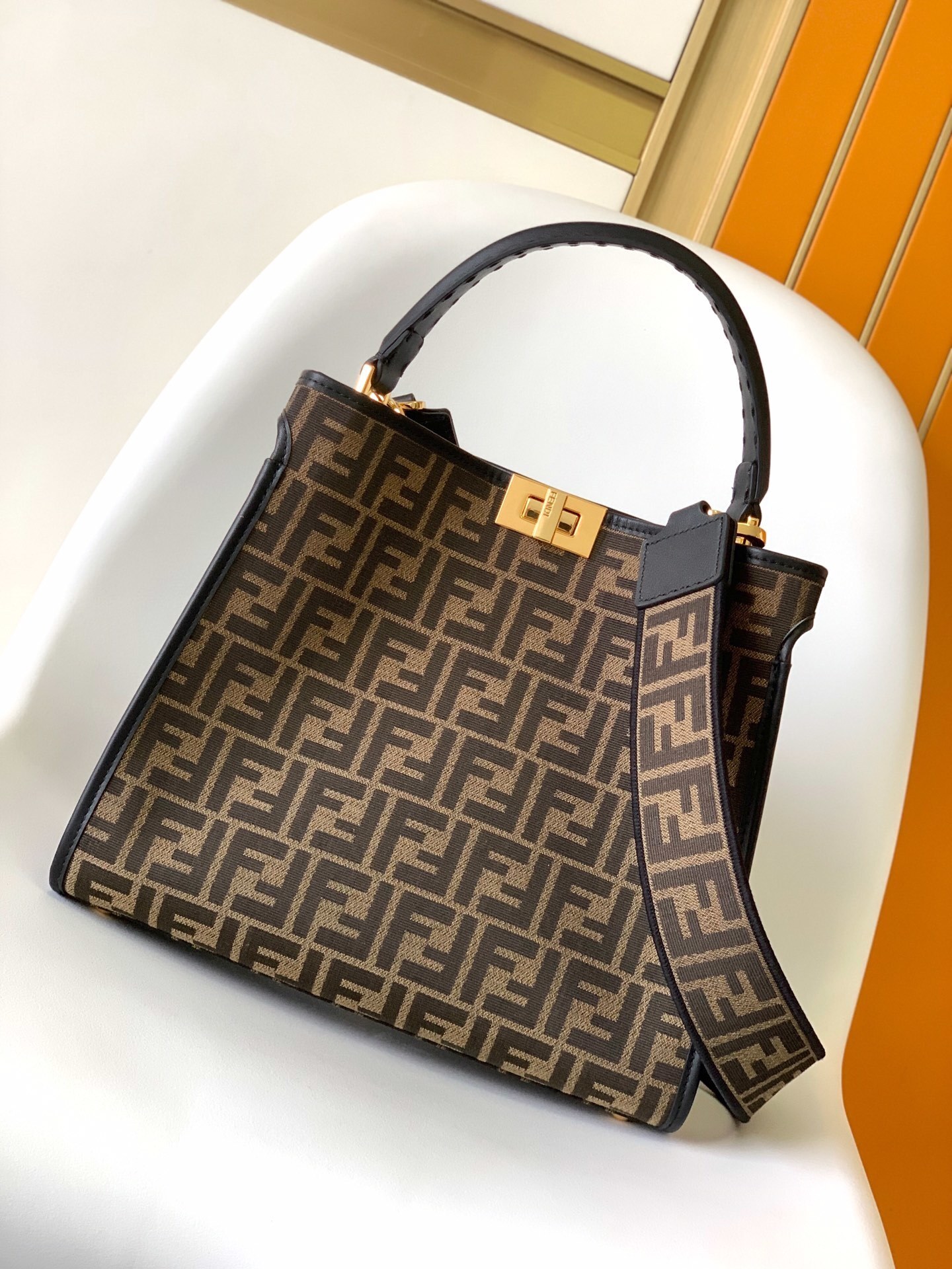 Fendi Peekaboo top handle bag featuring the iconic Zucca monogram pattern