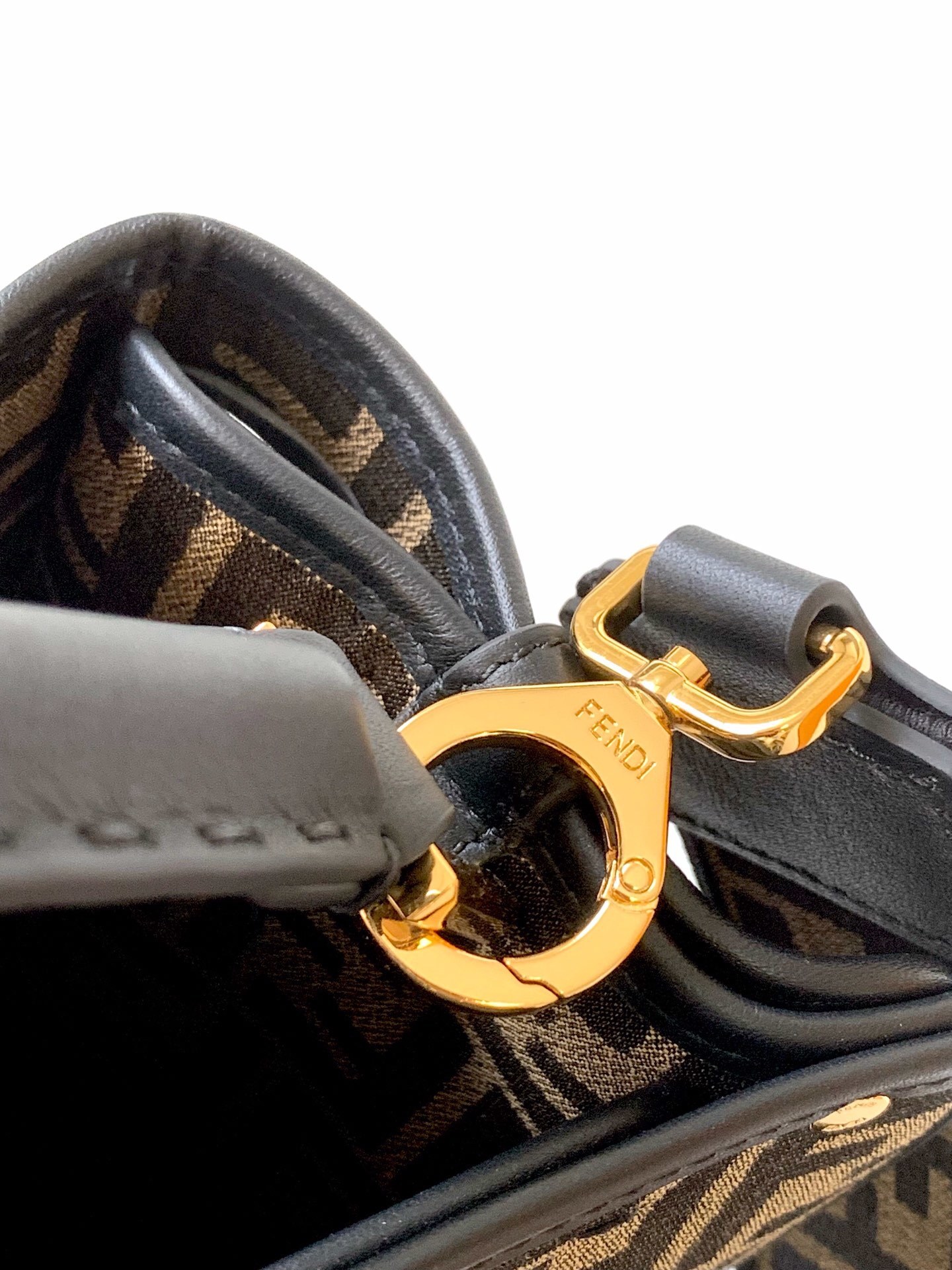 Fendi Peekaboo top handle bag featuring the iconic Zucca monogram pattern